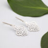 Sterling silver chandelier earrings with elegant design, suspended from shepherd hook.